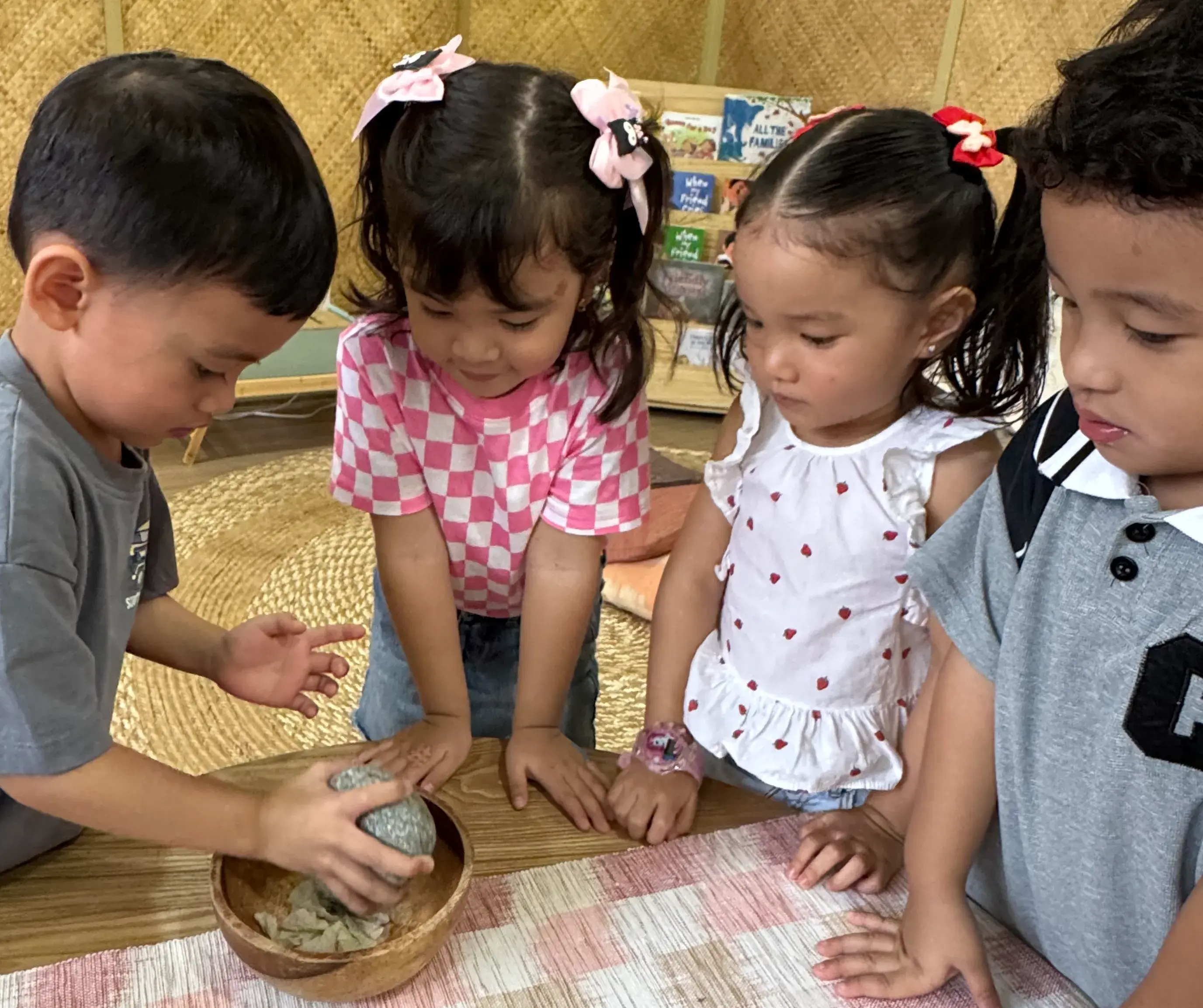 children happily listening to a teacher