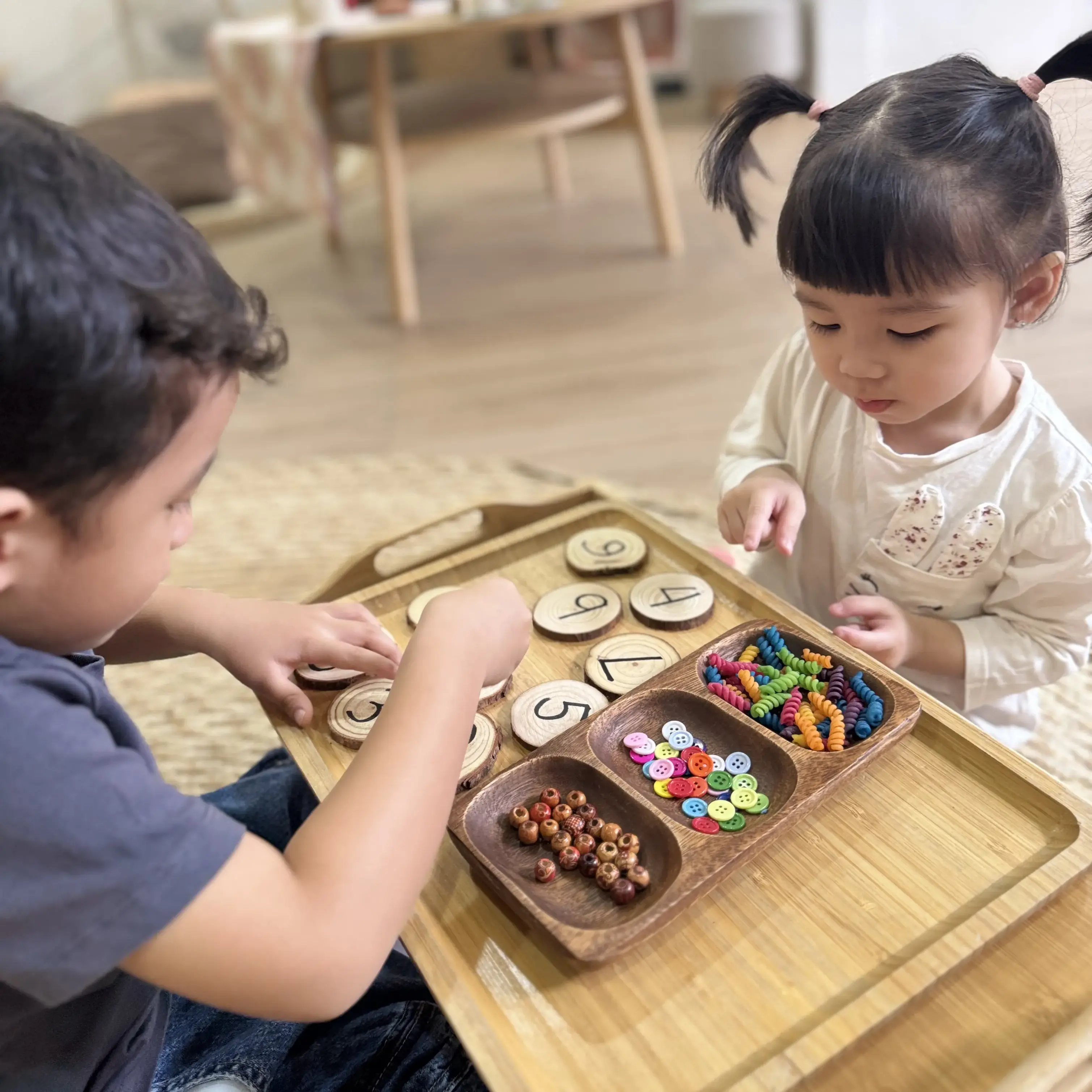 a smiling kid holding a clay ice cream